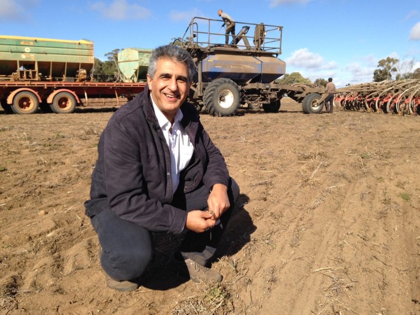 Amir Abadi (DPIRD) in front of seeder in 2015